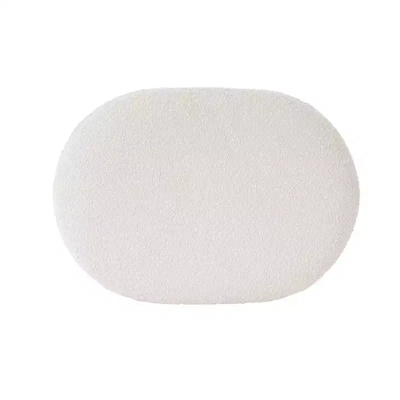 Pouf en tissu bouclé crème