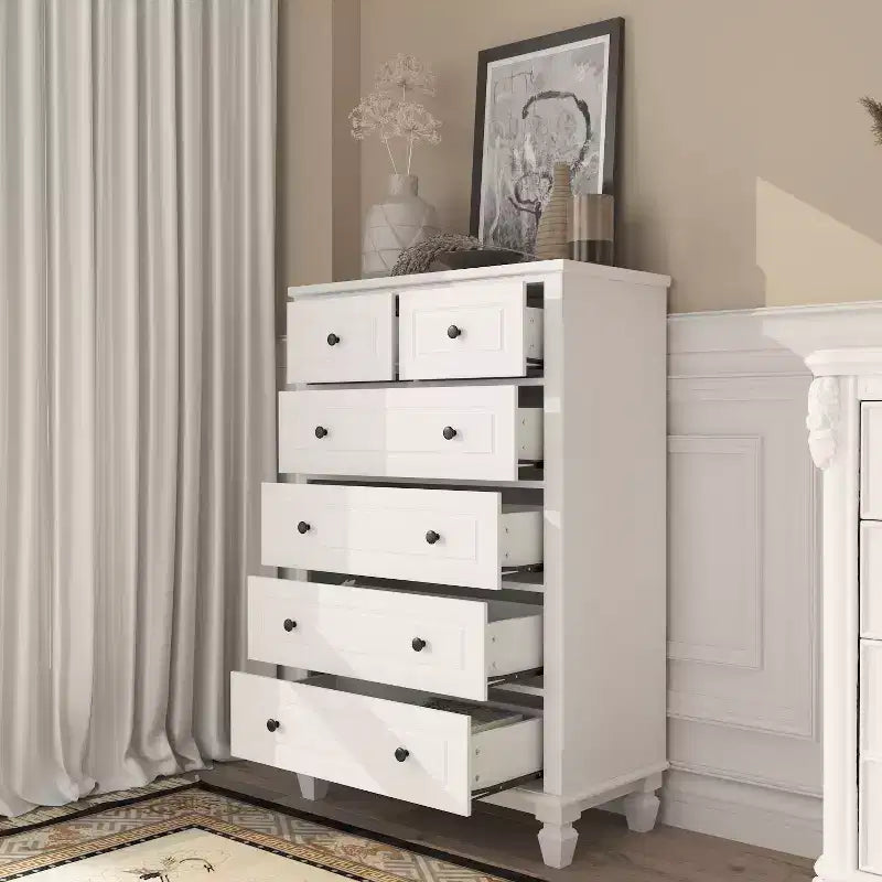 Commode verticale blanche moderne à 6 tiroirs avec pieds robustes et poignées métalliques